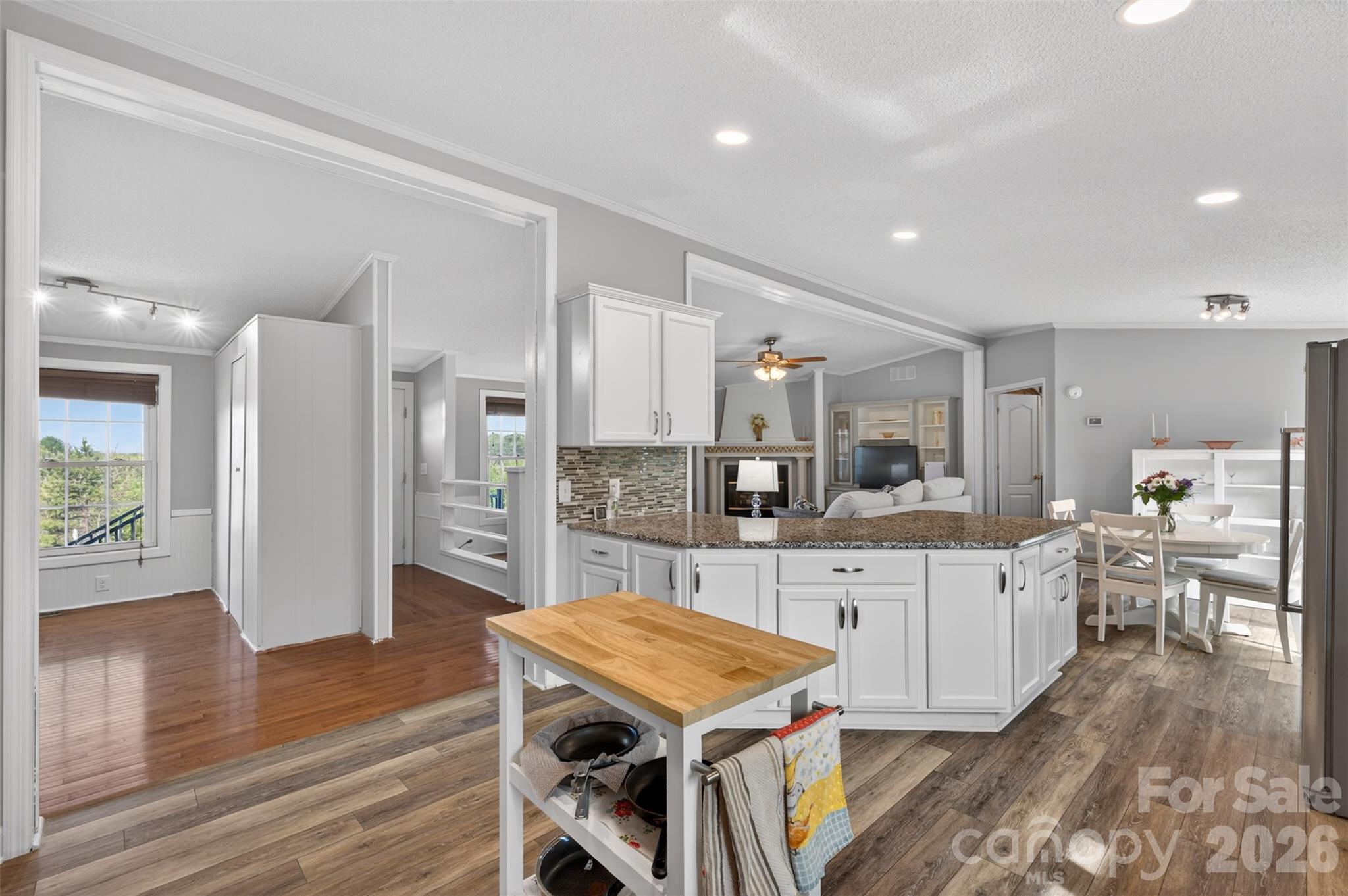 4352 Anderson Mountain Road Maiden, NC 28650 - Photo 11 of 42 a large kitchen with cabinets a sink a counter space and stainless steel appliances