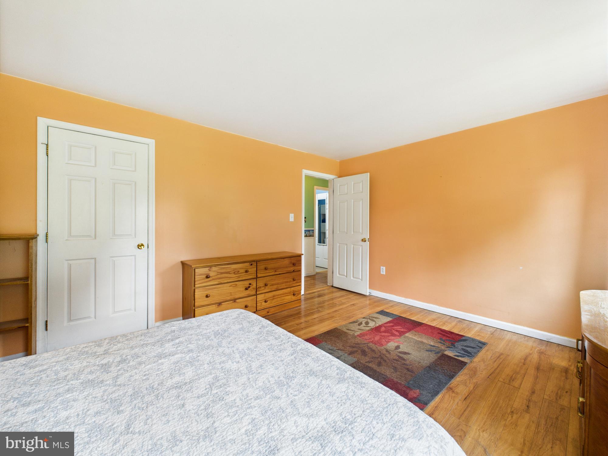 12502 Woodbridge Road Greenwood, DE 19950 - Photo 13 of 38 a bedroom with a bed and a cabinets