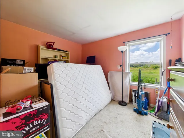 a bed room with a bed and a window