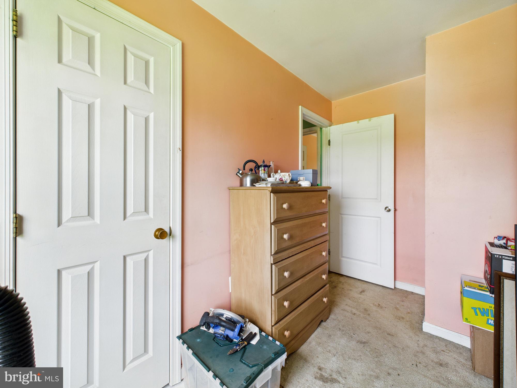 12502 Woodbridge Road Greenwood, DE 19950 - Photo 15 of 38 a bed room with a bed and furniture
