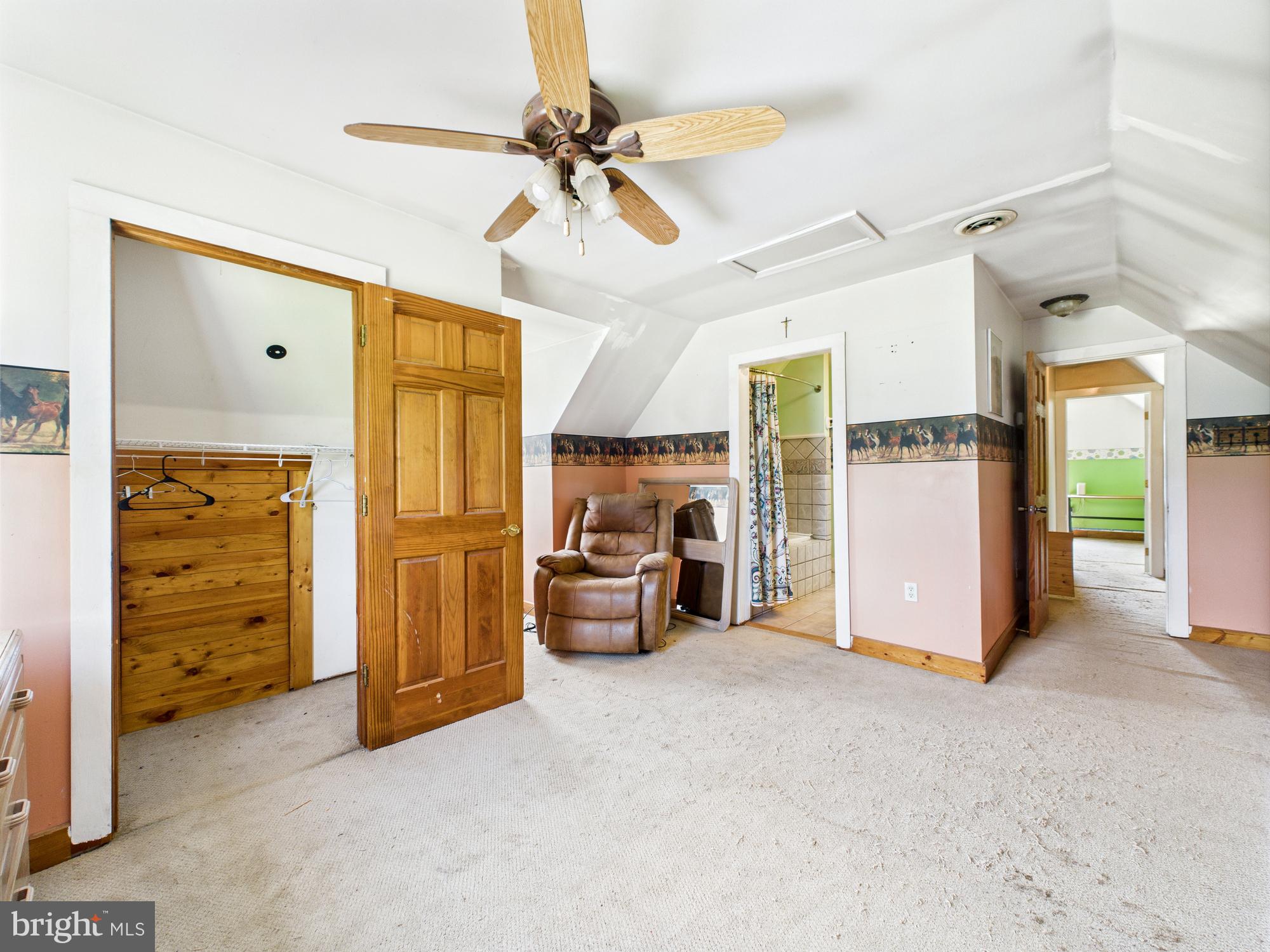 12502 Woodbridge Road Greenwood, DE 19950 - Photo 23 of 38 a view of a livingroom with furniture and a ceiling fan