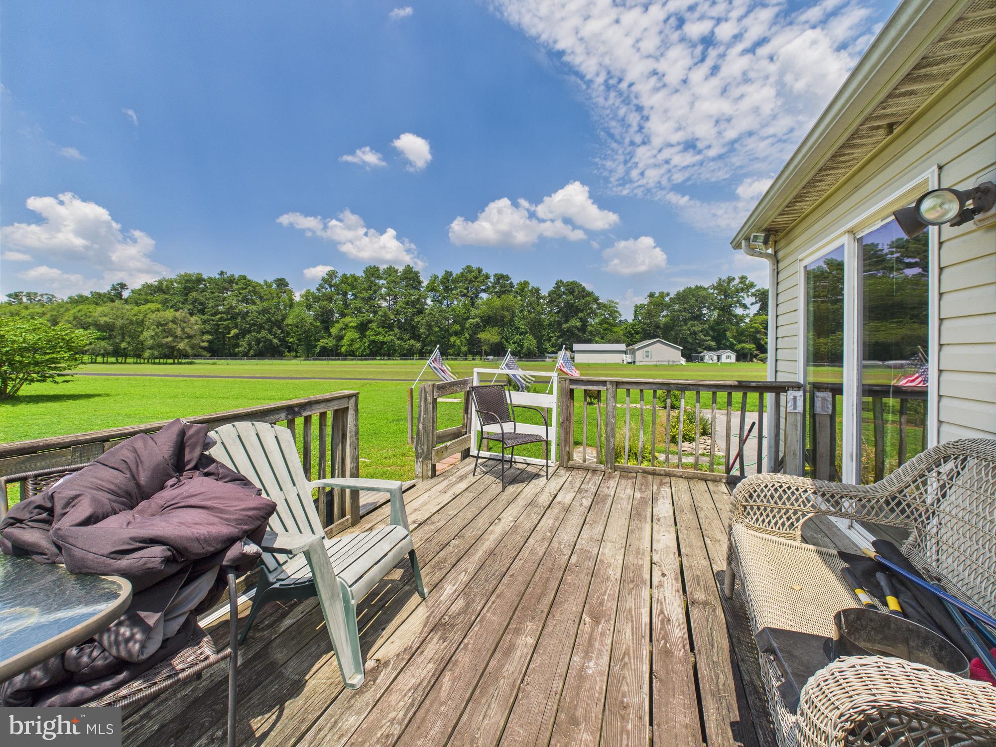 12502 Woodbridge Road Greenwood, DE 19950 - Photo 34 of 38 a view of deck with furniture and city view