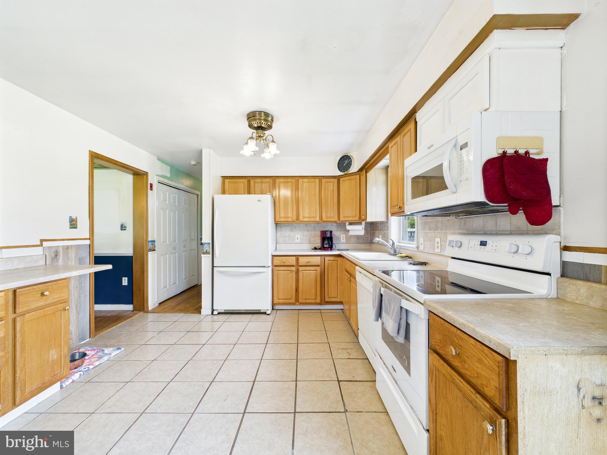 12502 Woodbridge Road Greenwood, DE 19950 - Photo 6 of 38 a kitchen with stainless steel appliances granite countertop a sink and cabinets