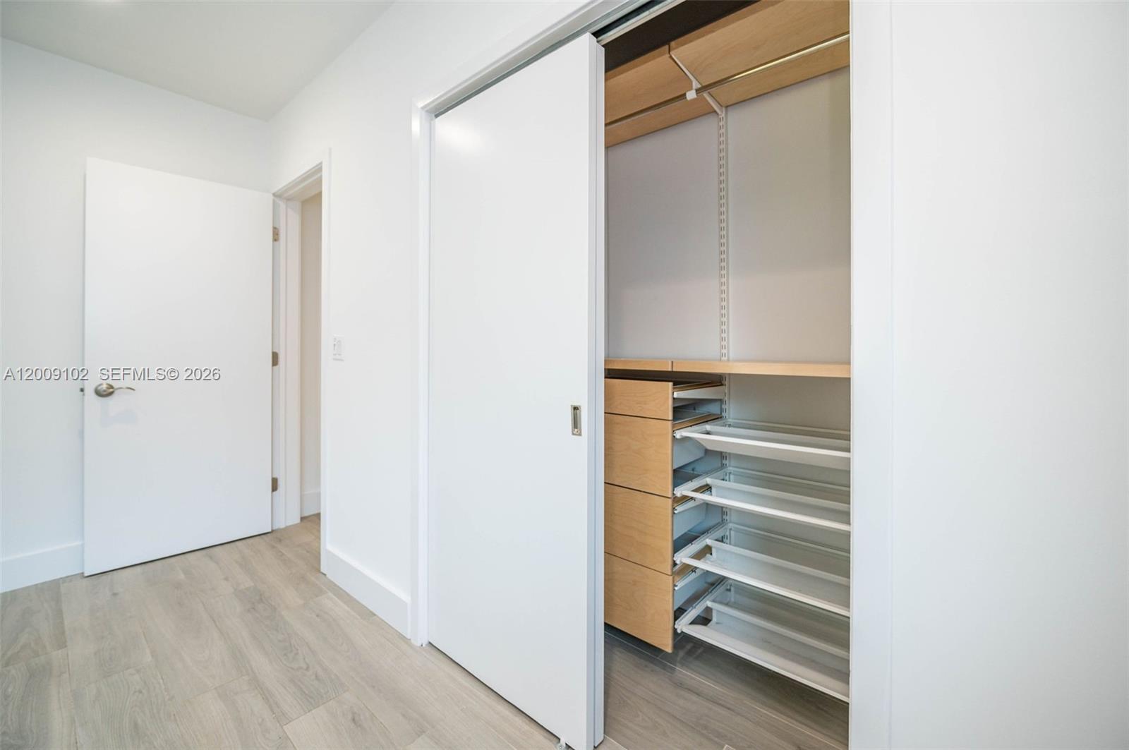 330 Southwest 27th Road Miami, FL 33129 - Photo 25 of 62 a view of walk in closet with empty racks