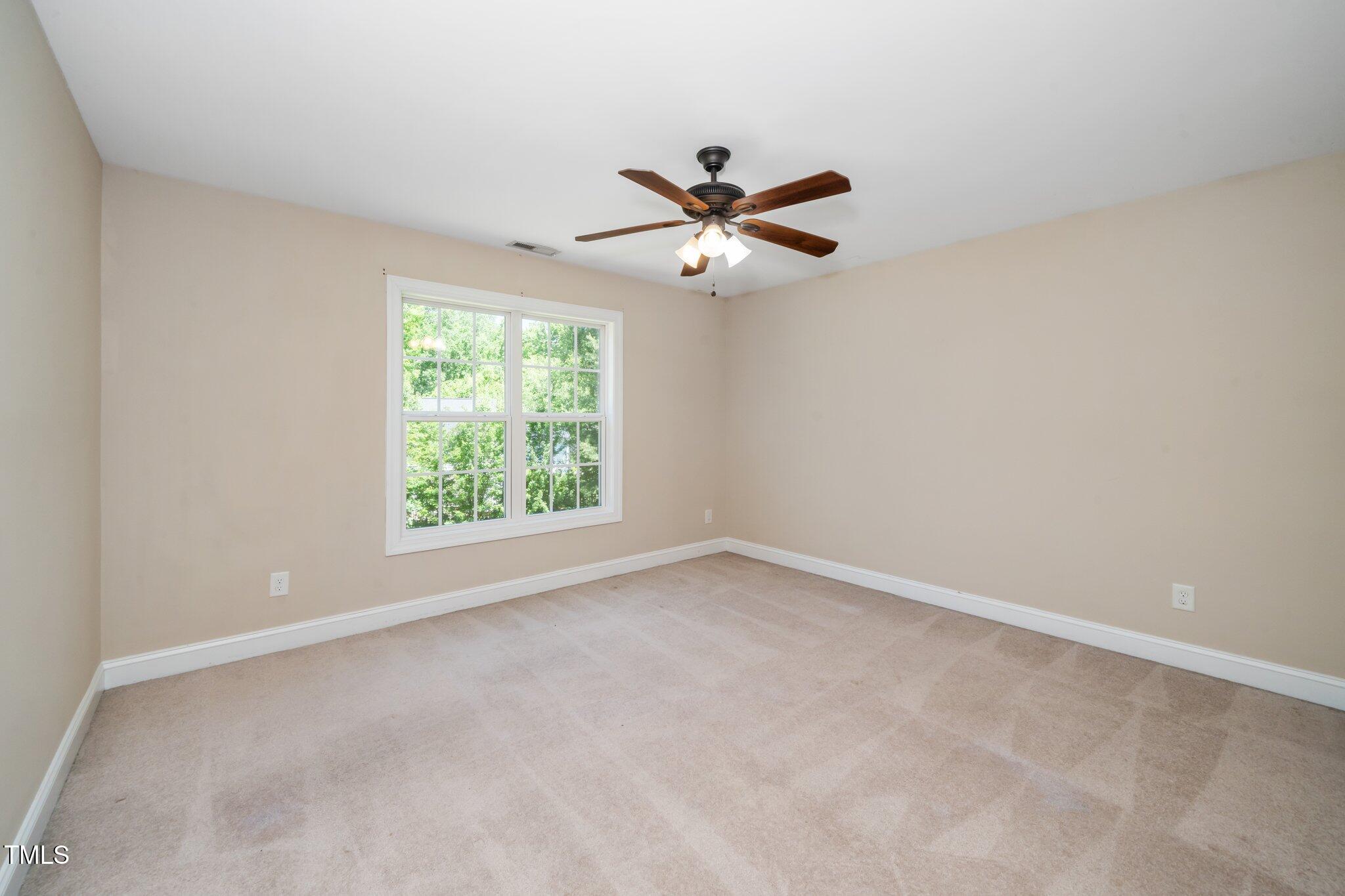 11612 Leesville Road Raleigh, NC 27613 - Photo 23 of 32 a view of room with a ceiling fan and window