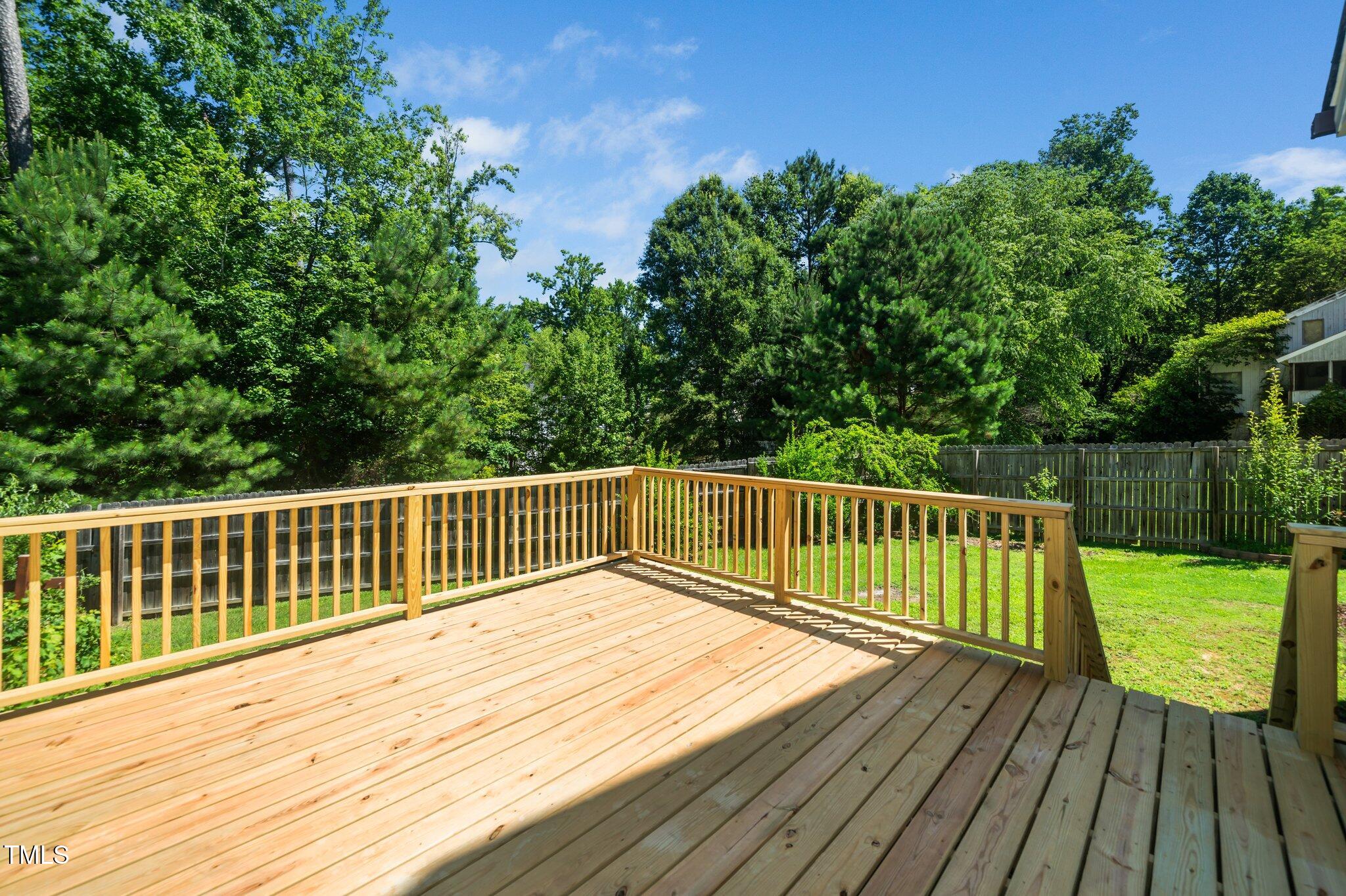 11612 Leesville Road Raleigh, NC 27613 - Photo 29 of 32 a view of balcony with wooden floor and fence