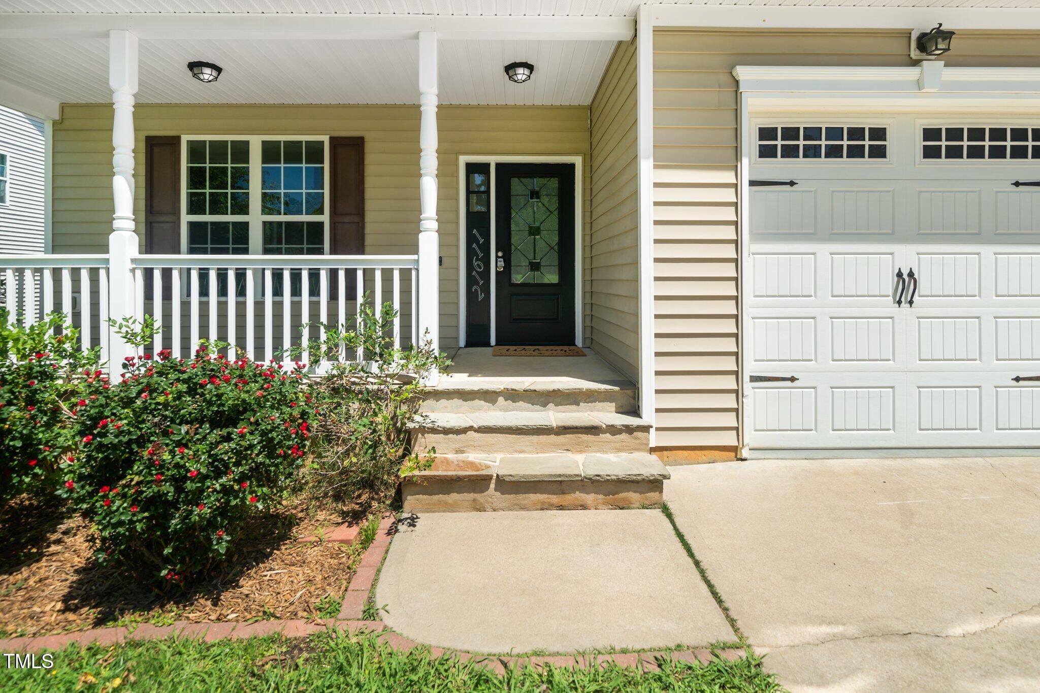 11612 Leesville Road Raleigh, NC 27613 - Photo 3 of 32 a view of a house with a small yard