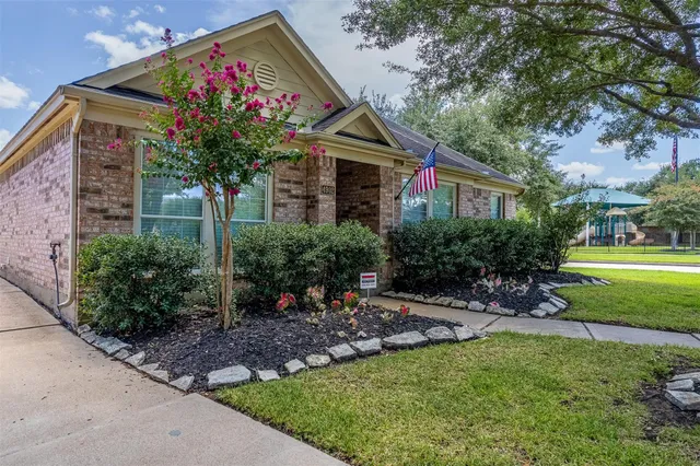 a view of a house with garden and plants