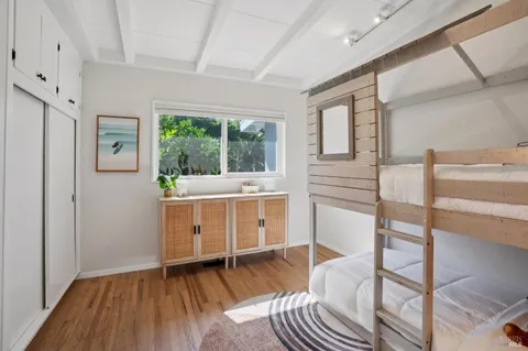a kitchen with a refrigerator stove and white cabinets