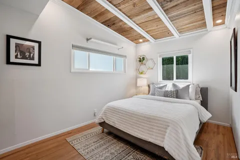 a bedroom with a large bed and a window