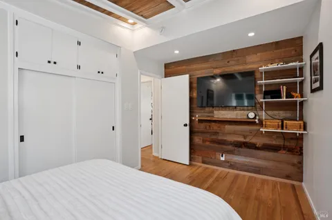 a bedroom with a bed and storage