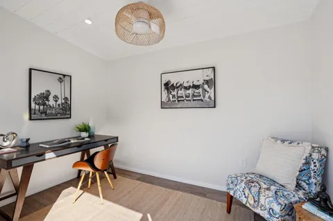 a view of a workspace with furniture and a couch