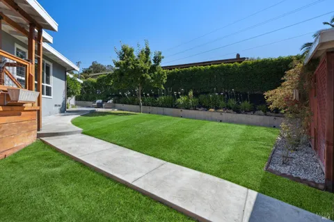 a view of a back yard of the house