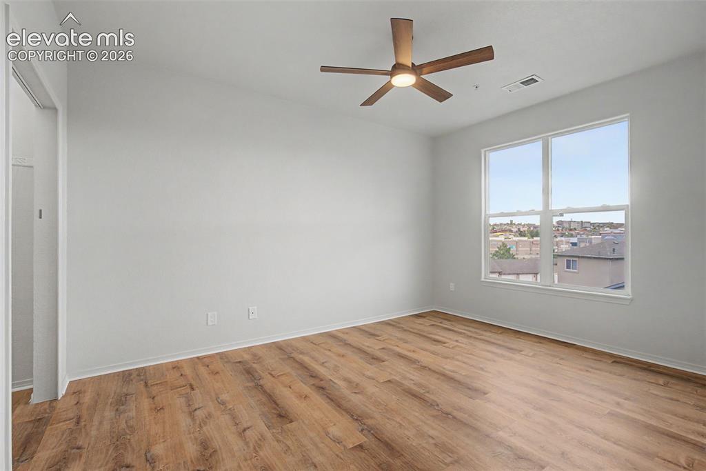 5353 Palomino Ranch Point, Unit 307 Colorado Springs, CO 80922 - Photo 23 of 30 New LVP flooring and ceiling fan with integrated lighting and fresh paint