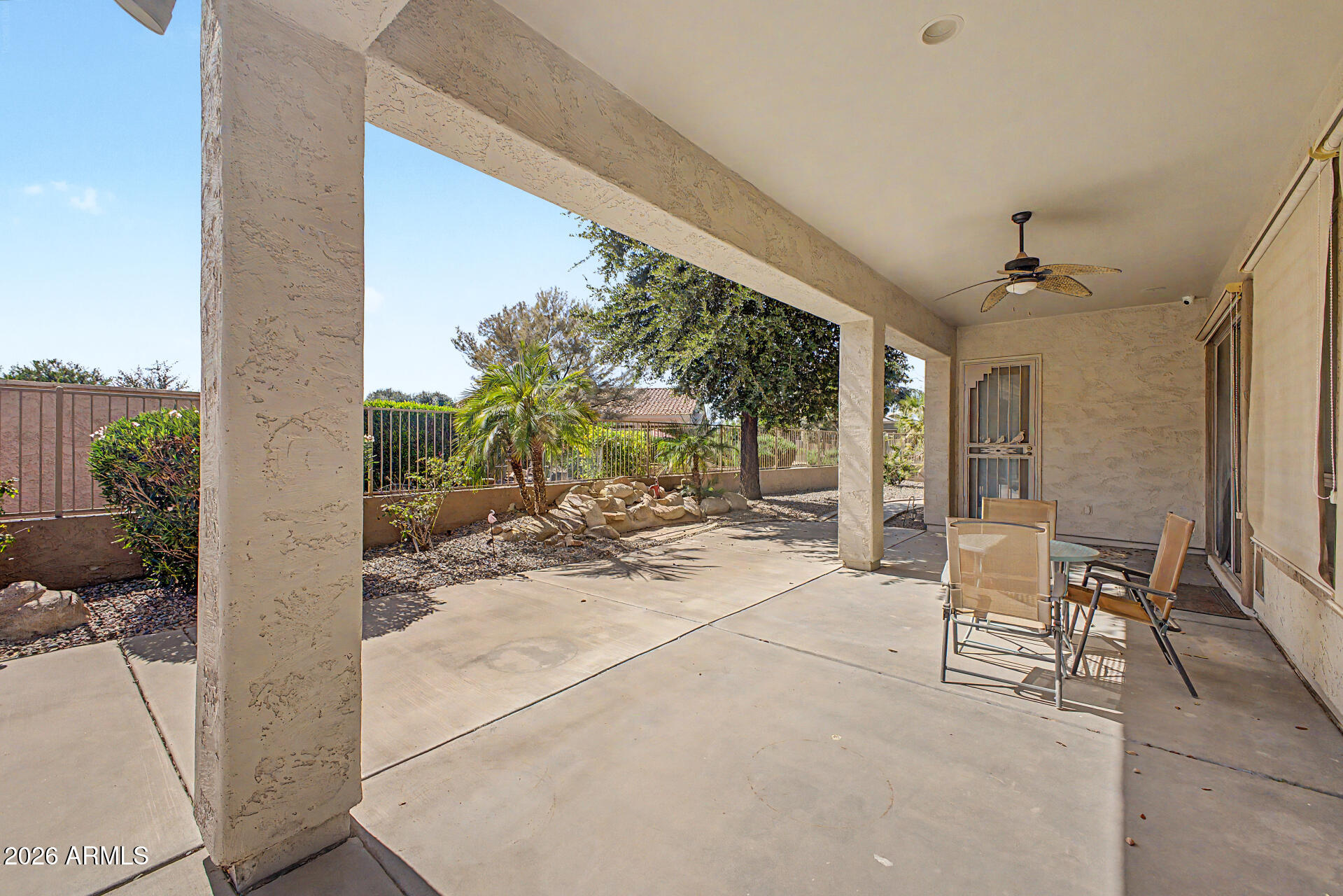 5090 South Ranger Trail Gilbert, AZ 85298 - Photo 29 of 50 a view of a patio with table and chairs and potted plants