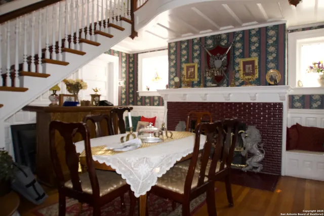a view of a dining room with furniture and chandelier