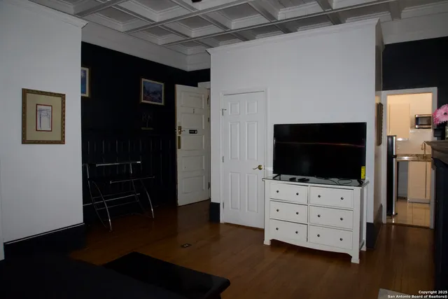 a room with furniture and flat screen tv
