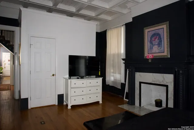 a room with furniture and flat screen tv