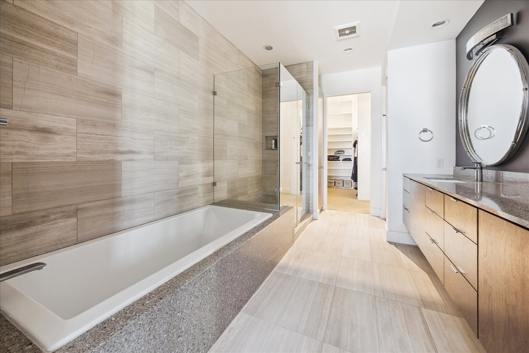 3331 D'Amico Street, Unit 404 Houston, TX 77019 - Photo 14 of 22 a spacious bathroom with a tub sink and mirror