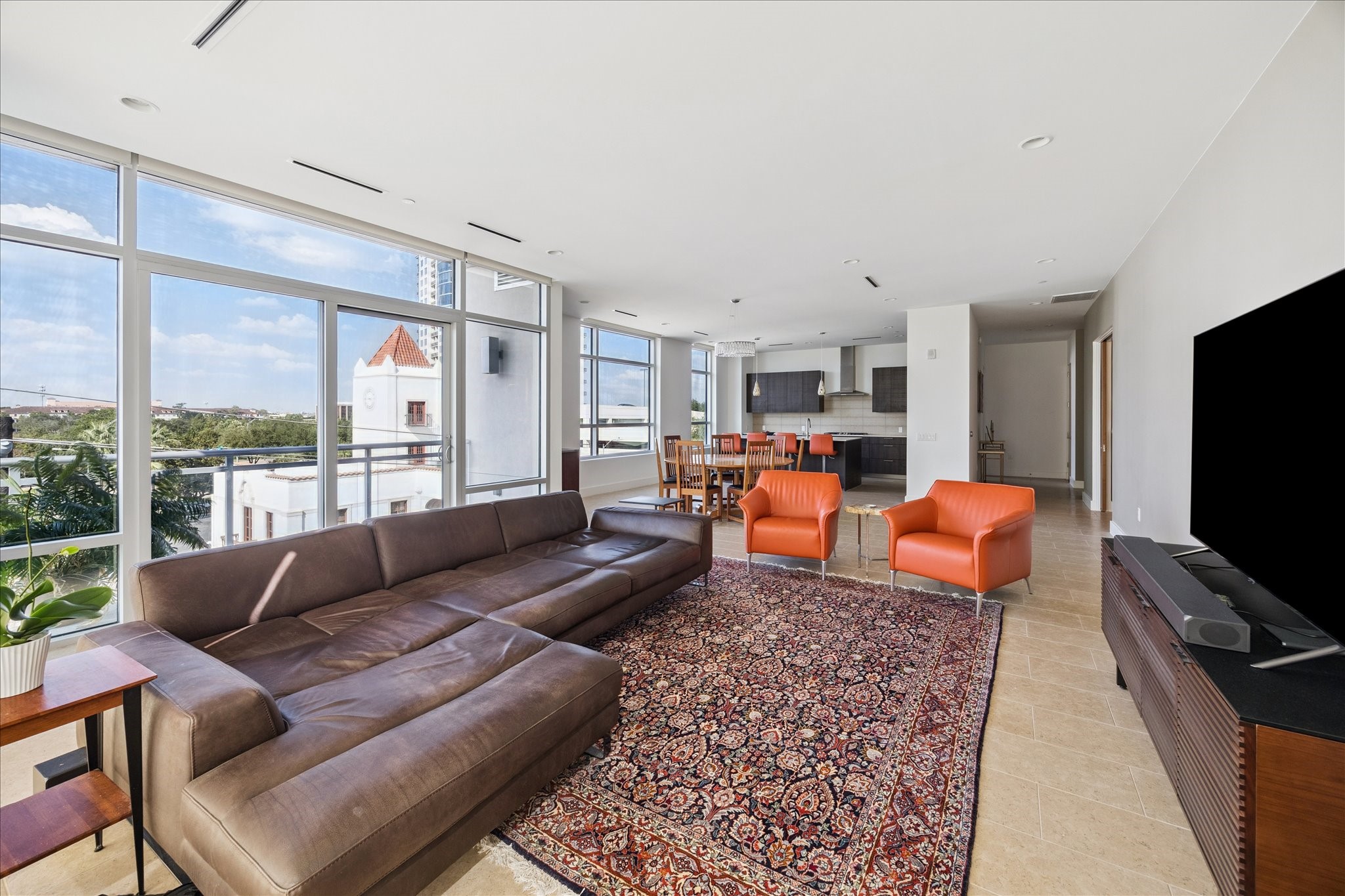 3331 D'Amico Street, Unit 404 Houston, TX 77019 - Photo 2 of 22 a living room with furniture and a flat screen tv