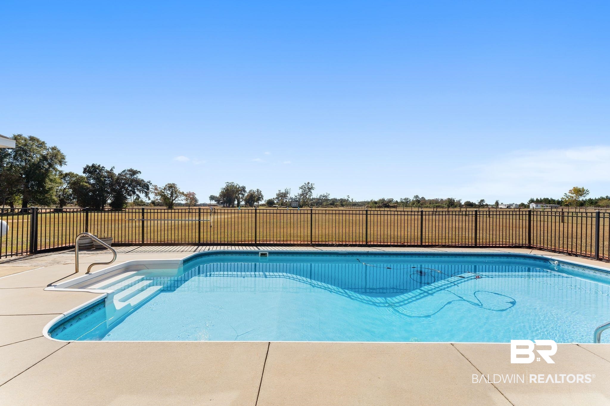 28980 Comstock Road Elberta, AL 36530 - Photo 23 of 38 View of swimming pool with a fenced backyard and a patio