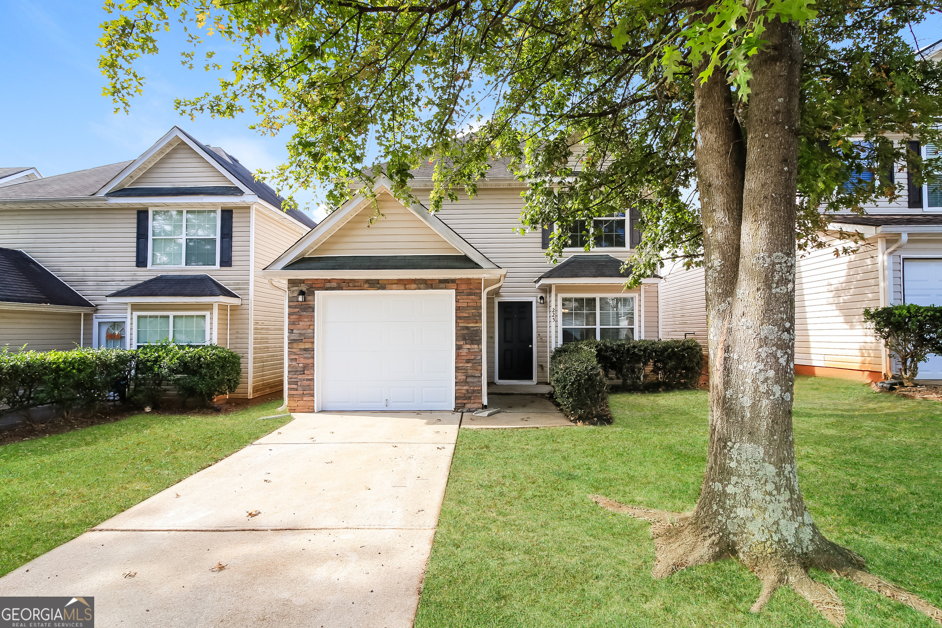 a front view of a house with yard