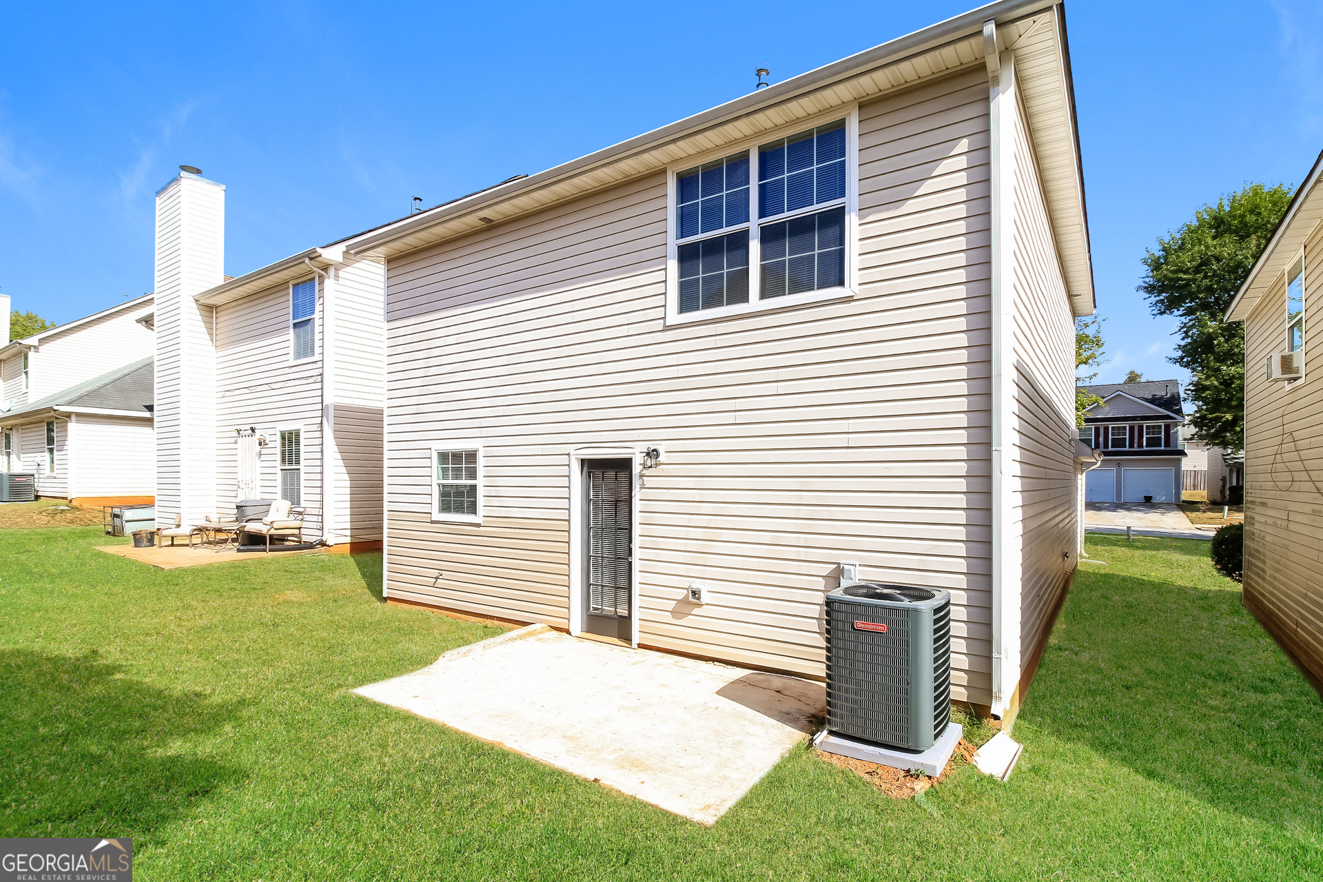 225 Colser Drive Covington, GA 30016 - Photo 15 of 17 a front view of a house with a yard