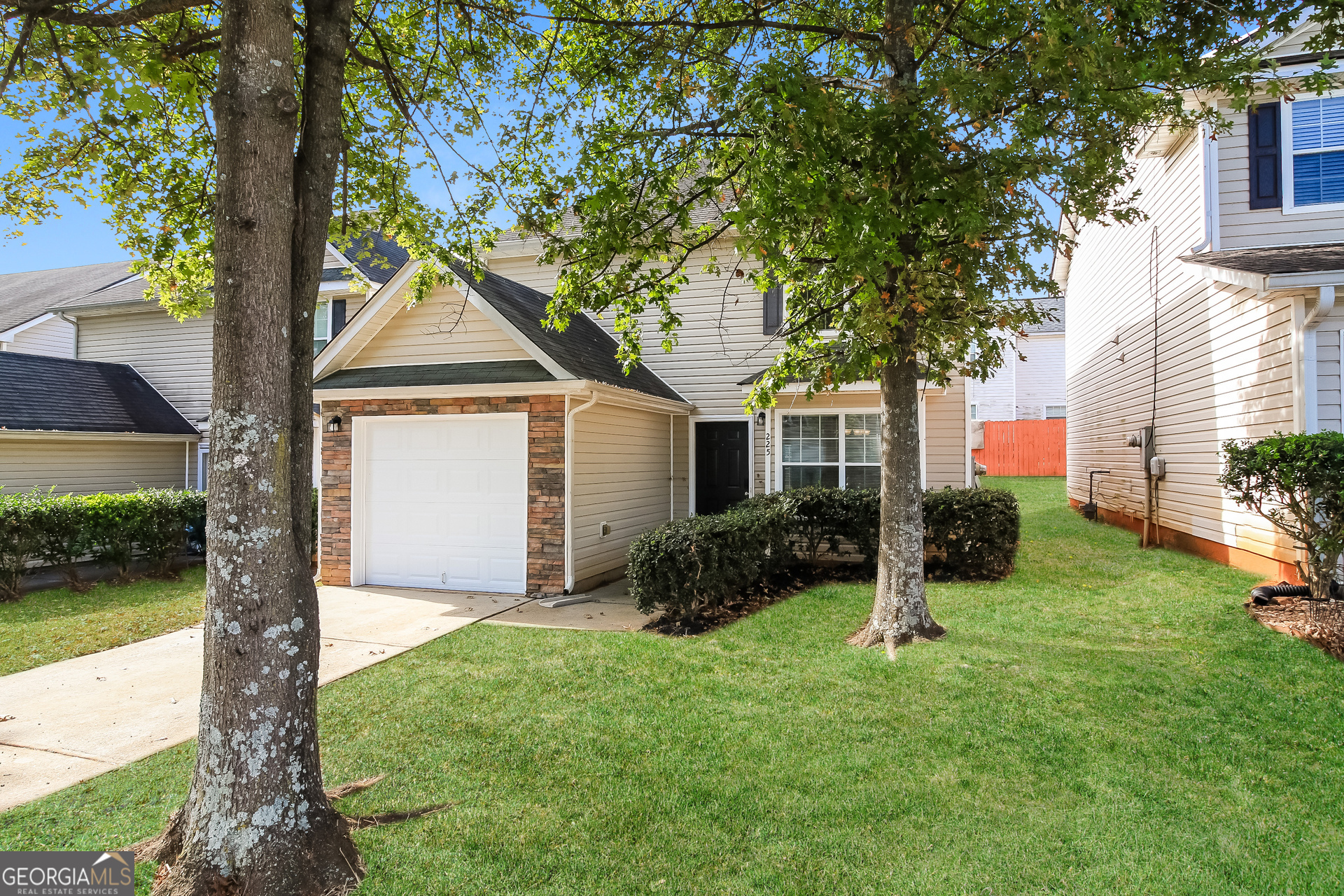 225 Colser Drive Covington, GA 30016 - Photo 2 of 17 a front view of a house with garden