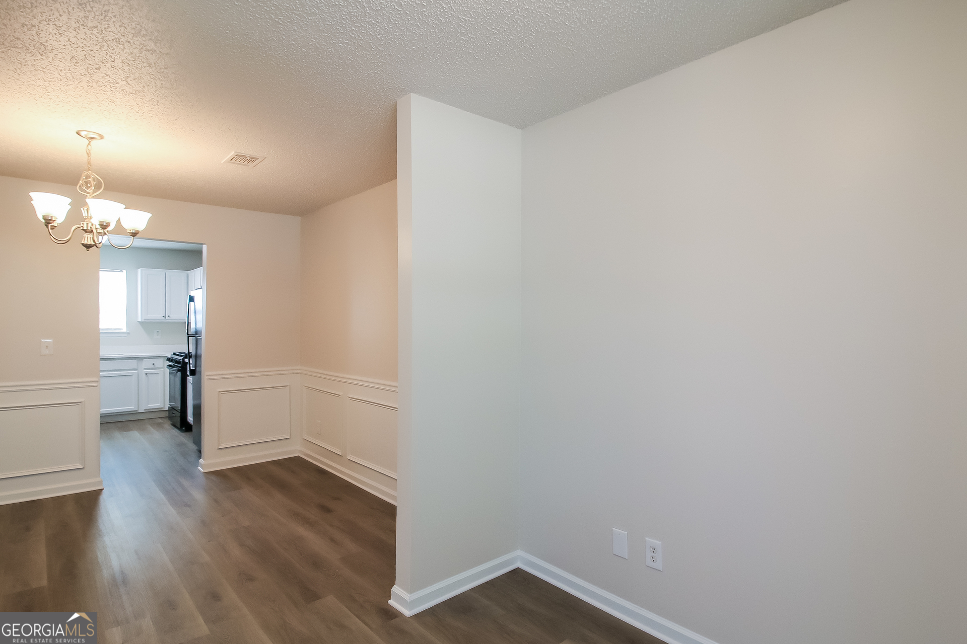 225 Colser Drive Covington, GA 30016 - Photo 4 of 17 a view of a room with wooden floor