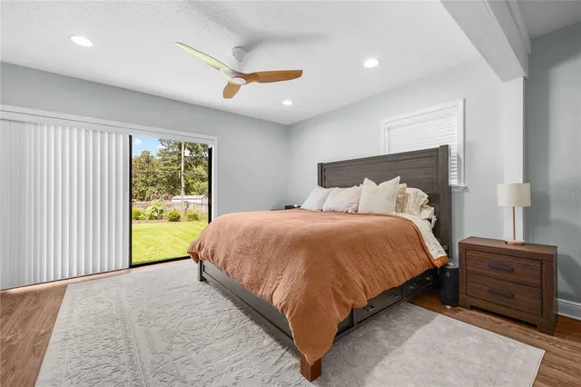 a bed sitting in a room next to a window