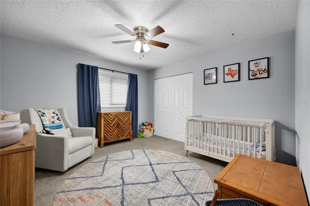 a bedroom with furniture and windows