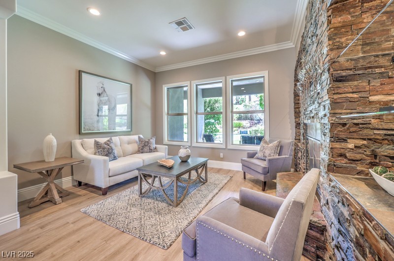 9135 Hickam Avenue Las Vegas, NV 89129 - Photo 11 of 75 Living room with wood finished floors, recessed lighting, and crown molding