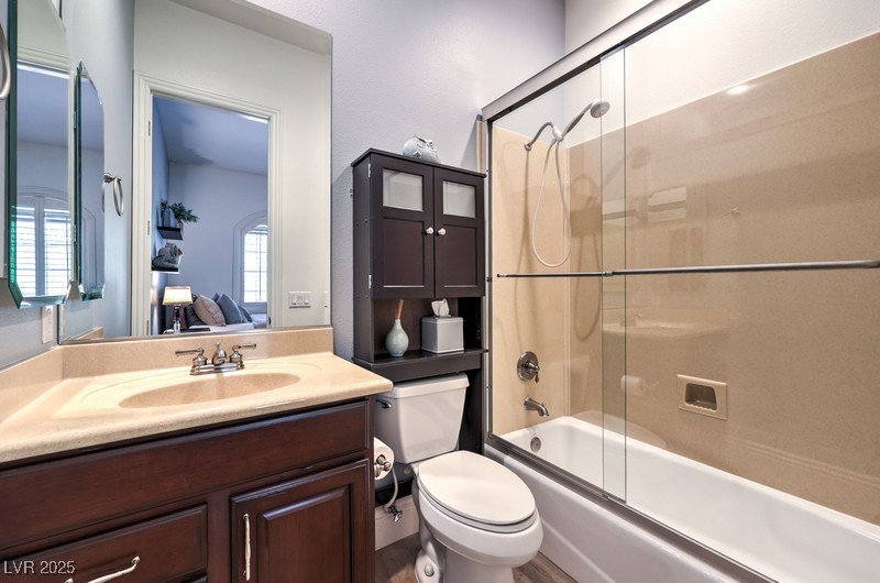 9135 Hickam Avenue Las Vegas, NV 89129 - Photo 38 of 75 Ensuite bathroom with vanity and bath / shower combo with glass door