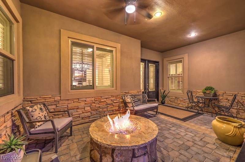 9135 Hickam Avenue Las Vegas, NV 89129 - Photo 4 of 75 View of patio / terrace featuring a fire pit and ceiling fan