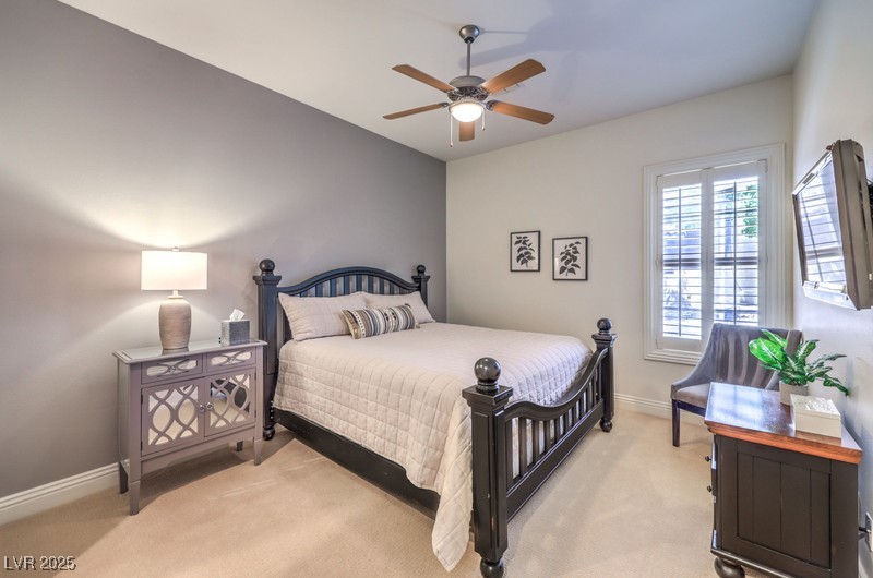 9135 Hickam Avenue Las Vegas, NV 89129 - Photo 43 of 75 Bedroom with light carpet and ceiling fan