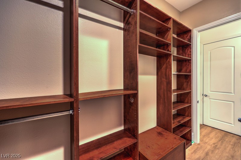9135 Hickam Avenue Las Vegas, NV 89129 - Photo 46 of 75 Spacious closet with wood finished floors