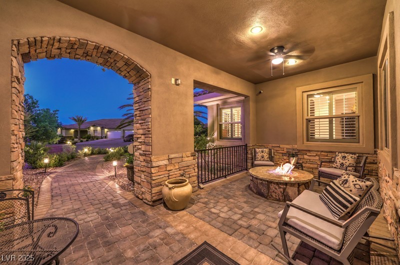 9135 Hickam Avenue Las Vegas, NV 89129 - Photo 5 of 75 View of patio featuring an outdoor fire pit and a ceiling fan