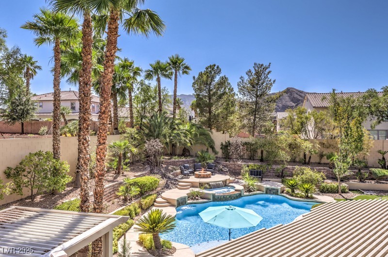 9135 Hickam Avenue Las Vegas, NV 89129 - Photo 53 of 75 View of pool featuring a pool with connected hot tub
