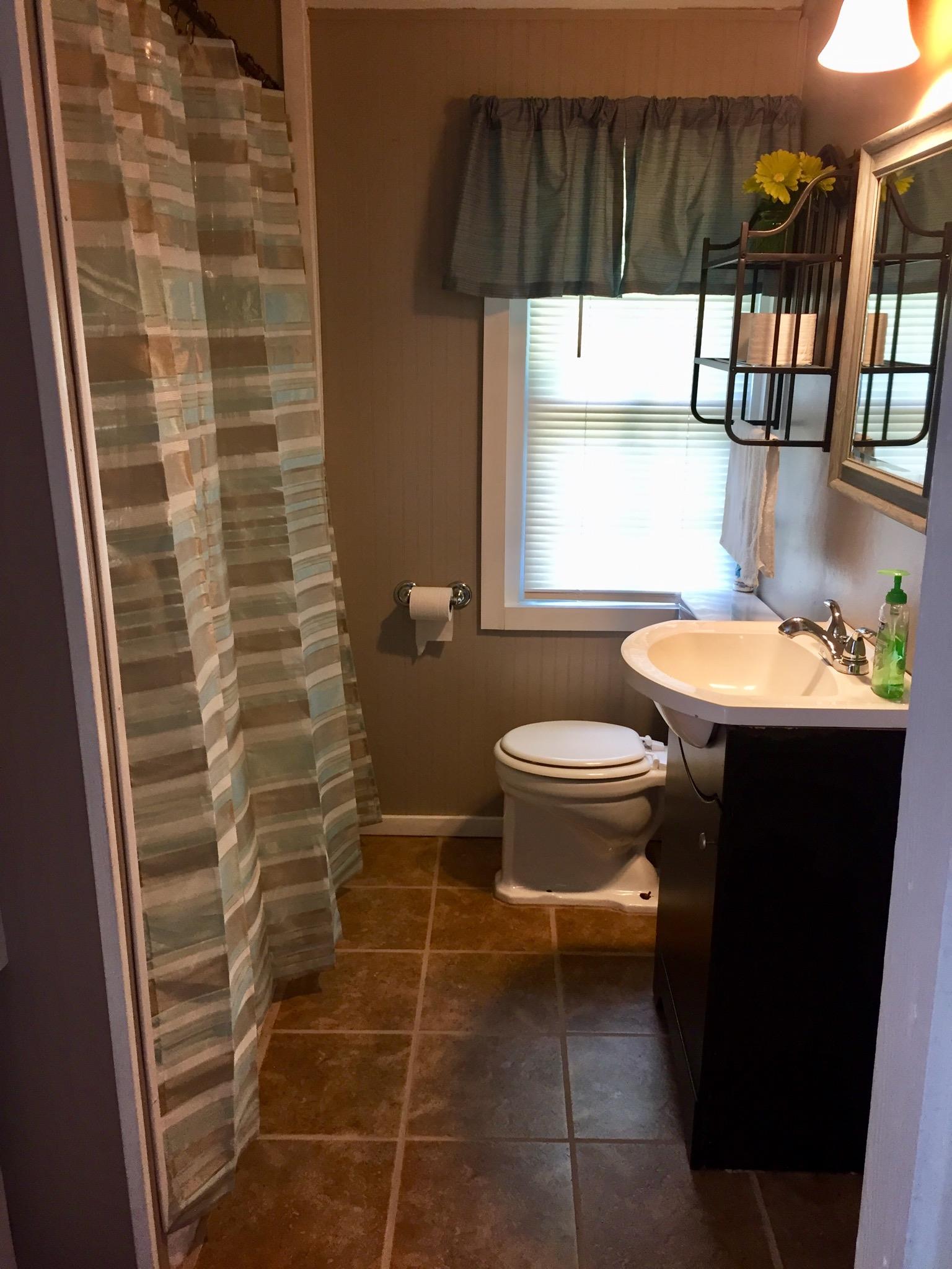 112 2 Valley Road Hendersonville, TN 37075 - Photo 12 of 25 a bathroom with a sink a toilet and shower