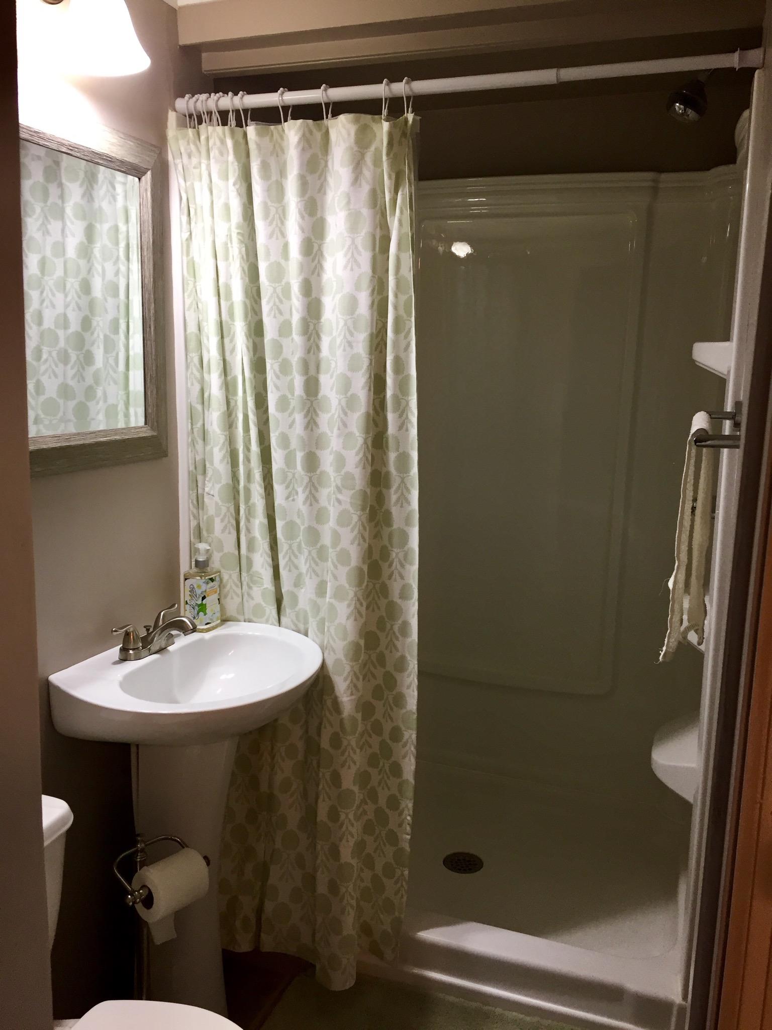 112 2 Valley Road Hendersonville, TN 37075 - Photo 21 of 25 a bathroom with a sink a mirror and a shower