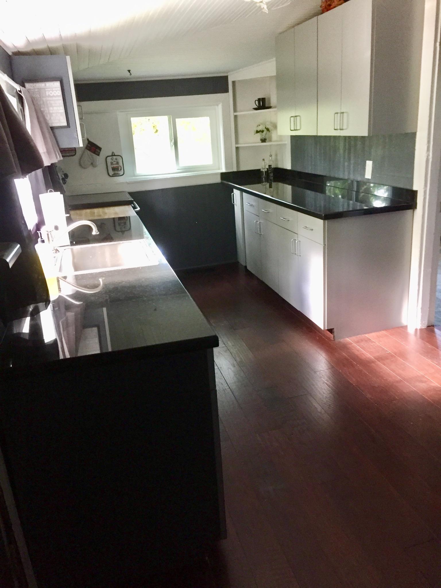 112 2 Valley Road Hendersonville, TN 37075 - Photo 7 of 25 a kitchen with kitchen island a sink dishwasher a stove and a microwave oven