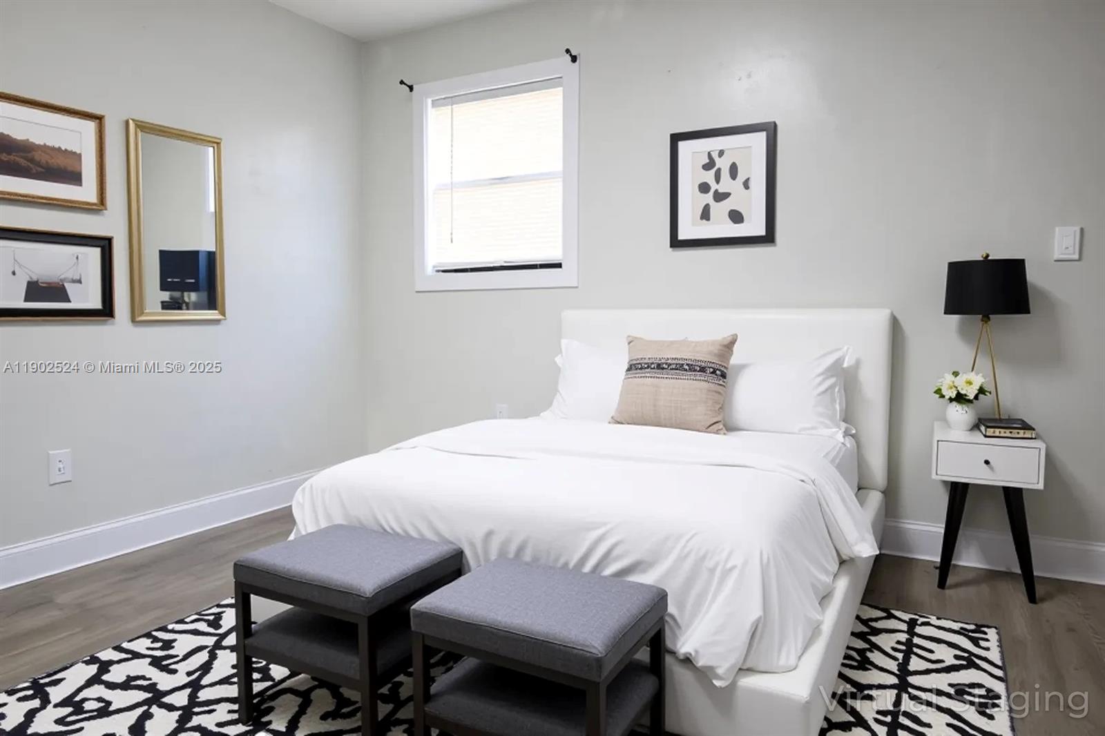 3216 22nd Street Southwest Lehigh Acres, FL 33976 - Photo 14 of 28 a bedroom with a bed and a lamp on dresser