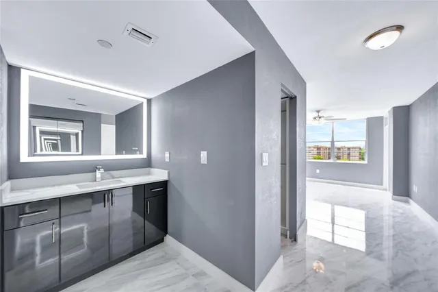 a bathroom with a sink and a mirror