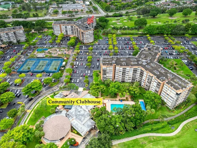 a view of yard with seating area and car parked