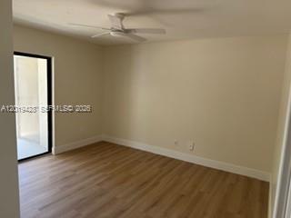 610 South Park Road, Unit 261 Hollywood, FL 33021 - Photo 11 of 13 an empty room with wooden floor closet and windows