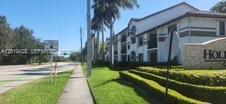 610 South Park Road, Unit 261 Hollywood, FL 33021 - Photo 2 of 13 a garden view with a fountain