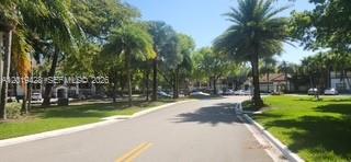 610 South Park Road, Unit 261 Hollywood, FL 33021 - Photo 3 of 13 a view of a yard with palm trees