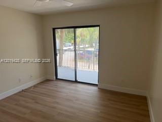 610 South Park Road, Unit 261 Hollywood, FL 33021 - Photo 10 of 13 a view of an empty room with wooden floor and a window