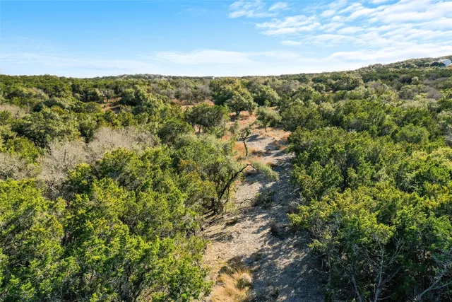 a view of a backyard of the house