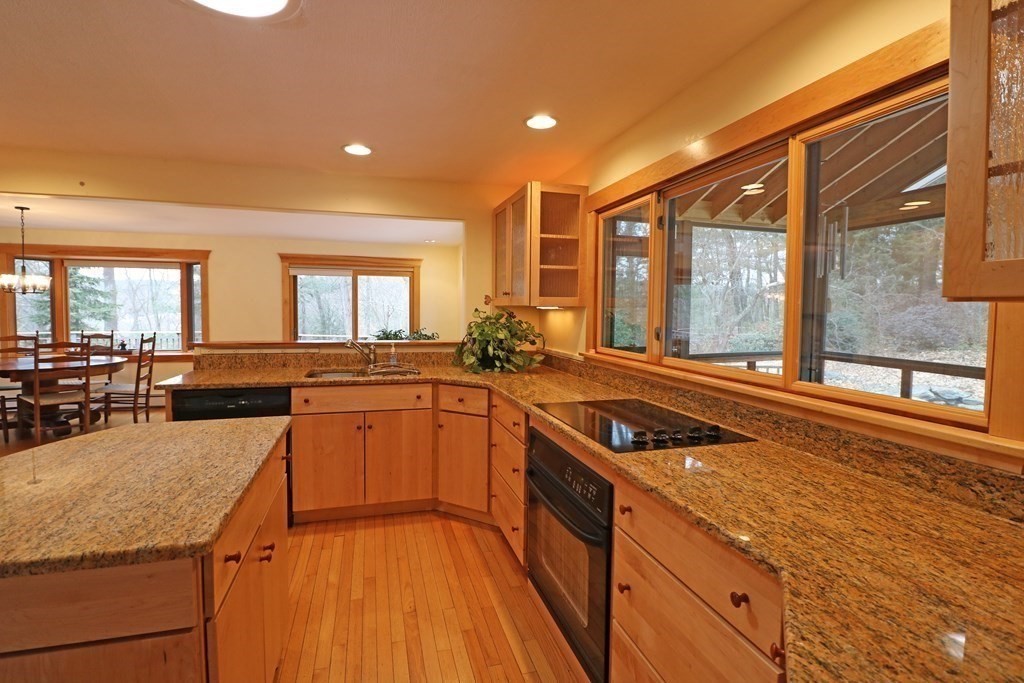 20 Under Pin Hill Road Harvard, MA 01451 - Photo 12 of 41 a kitchen with stainless steel appliances granite countertop a stove and a sink
